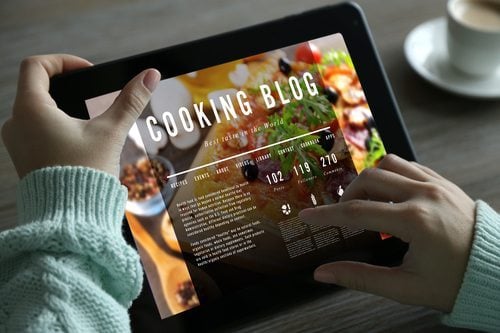 person looking at cooking blog